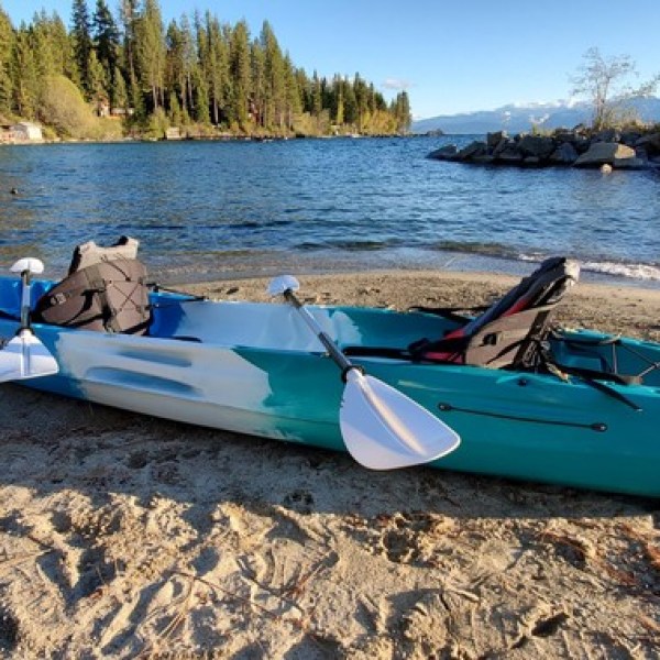 a boat sitting on top of a sandy beach
